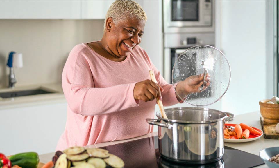 senior woman cooking at home