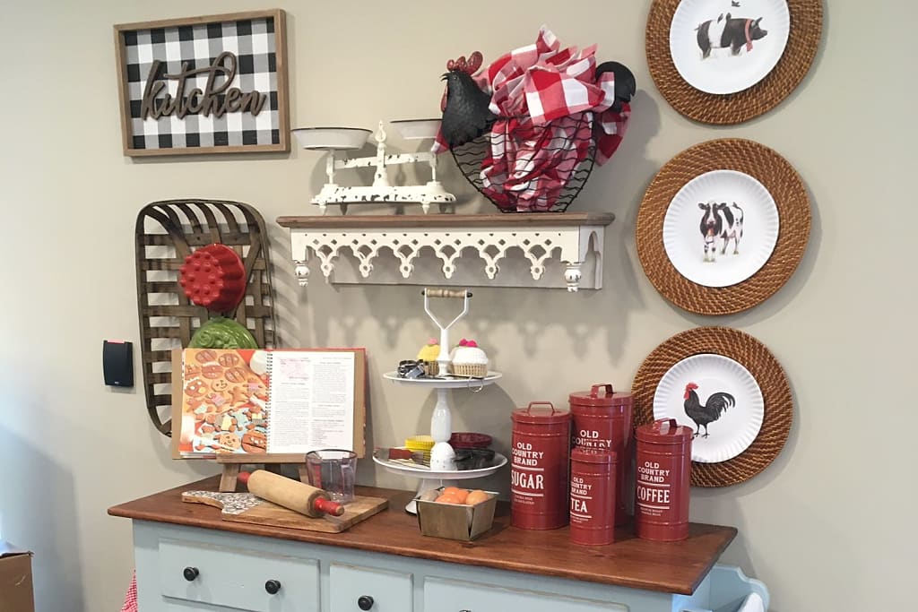 Cafe area display decorated with sweets, coffee, tea, and a cookbook.